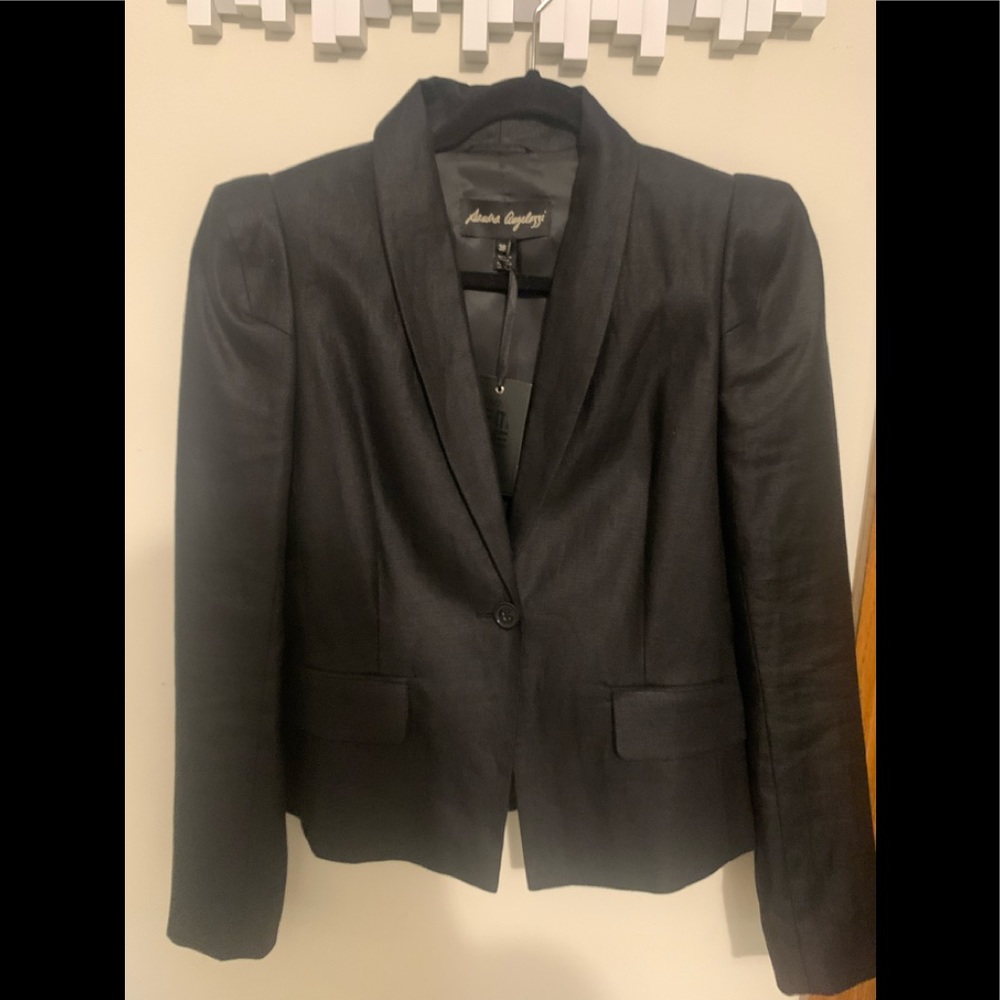 New linen blazer that is very structured with accentuated shoulder